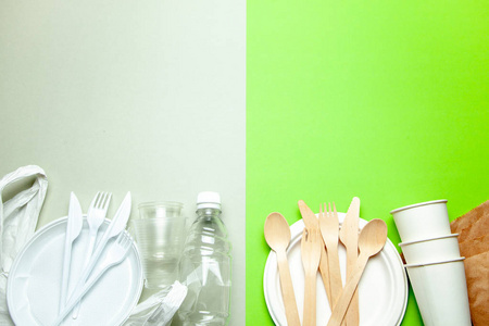 绿色背景, 用竹木和纸制成的环保一次性餐具。塑料有害菜肴和餐具