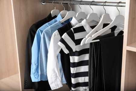 s clothes hanging on rack