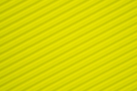 黄色瓦楞纸纹理用于背景。 生动的颜色与复制空间，以添加文本或对象。