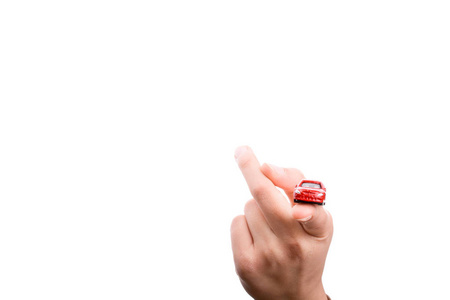 s hand holding a red car on a white background