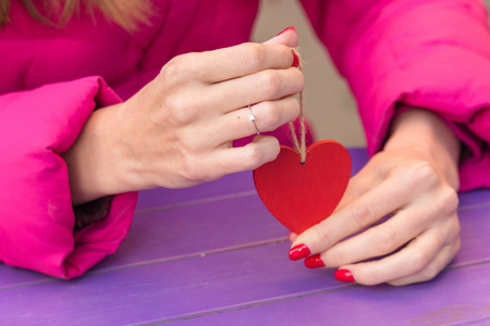 s Day. Wedding ring on the finger. Girl in love. The red heart i