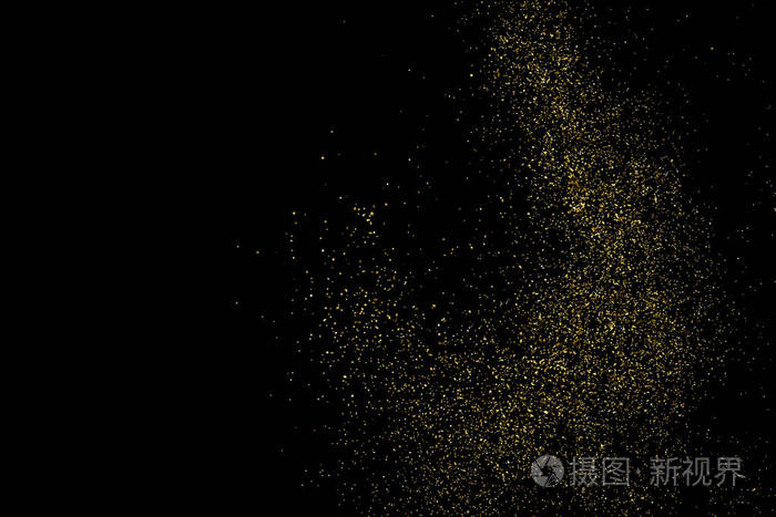 金色闪光的纹理隔离在黑色上. 琥珀颗粒的颜色. 庆祝背景.