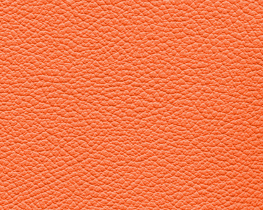橙色皮革质地。 作为设计作品的背景