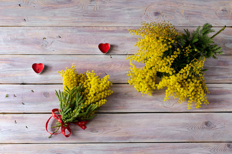 s Day or birthday. Romantic bouquet of yellow mimosa and candles