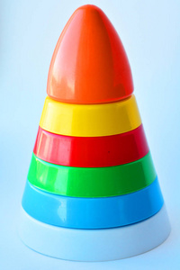 s toy pyramid from multi colored circles on a white background