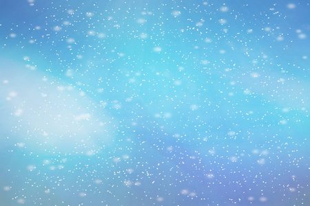 抽象的蓝色Bokeh离焦背景。 冬天有雪。