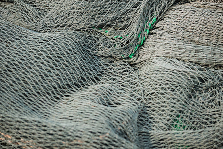 渔网关闭纹理背景灰色和绿色图案
