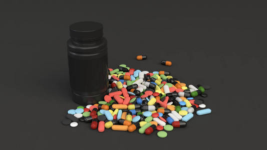 黑色药丸真实的空白黑色塑料瓶和一堆药丸在黑色背景上. 医疗容器.