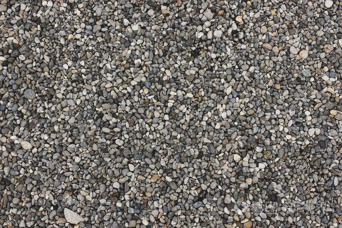 照片 灰白色天然砂和石头纹理的地面.点缀灰色岩石地板,有文字的地方.