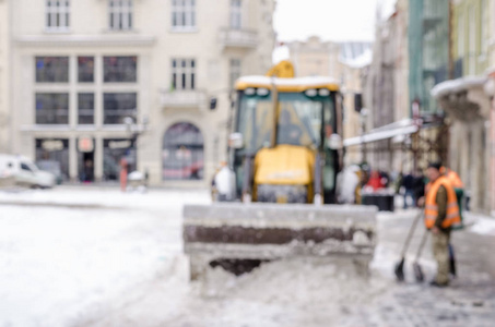 模糊的冬天背景城市雪清洁技师拖拉机雪公共服务生活恶劣的天气生活方式圣诞节寒冷的秋天雪游客全景旧城