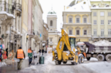 模糊的冬天背景城市雪清洁技师拖拉机雪公共服务生活恶劣的天气生活方式圣诞节寒冷的秋天雪游客全景旧城