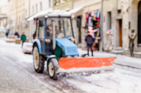 模糊的冬天背景城市雪清洁技师拖拉机雪公共服务生活恶劣的天气生活方式圣诞节寒冷的秋天雪游客全景旧城