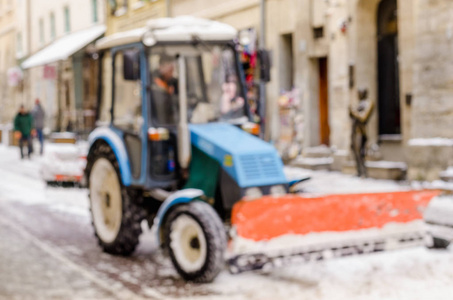 模糊的冬天背景城市雪清洁技师拖拉机雪公共服务生活恶劣的天气生活方式圣诞节寒冷的秋天雪游客全景旧城