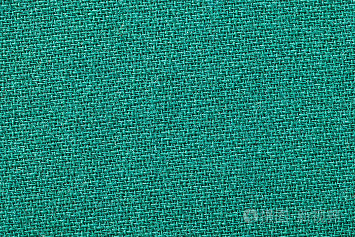 绿色织物背景纹理. 纺织材料的细节特写.