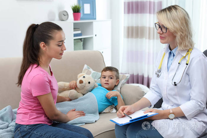 s doctor visiting little boy at home