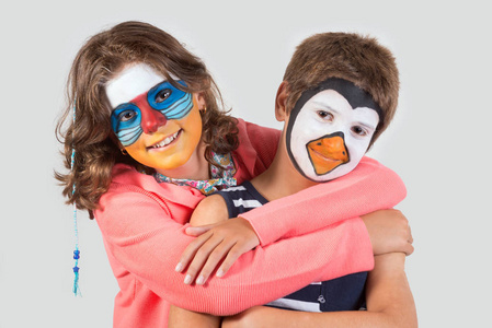 s couple with animal facepaint isolated in white