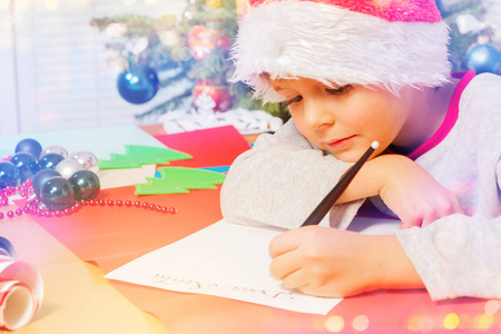 s costume writing a Christmas letter indoors