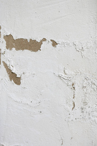粗糙的纹理的一个古老的灰色白色墙壁