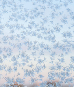 窗户上结冰的雪花。 冬季背景。 纹理纹理纹理