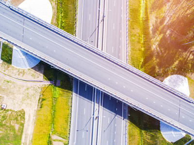 s eye photo of highway. Expressway. Road junctions. Car passing.