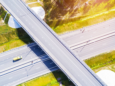 s eye photo of highway. Expressway. Road junctions. Car passing.