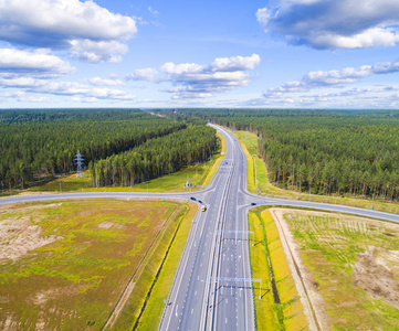 s eye photo of highway. Expressway. Road junctions. Car passing.