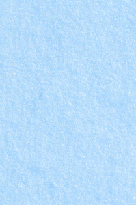 蓝色色调的雪质地。雪白的纹理..冬天的背景是飘雪