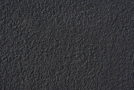 粗糙的黑色水泥抹灰墙面纹理图片