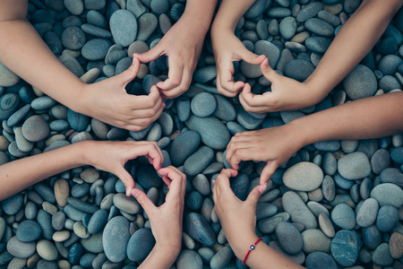 s hands, figures, heart, on the pebble stones