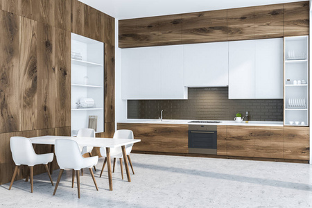 现代厨房的角落，黑色砖墙，混凝土地板，木制台面，白色橱柜，白色和木制橱柜在左边。 带椅子的白色桌子。 3D渲染