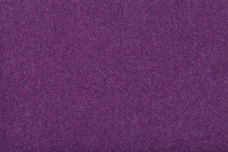 罗兰马特深紫色哑光背景的绒面织物特写.