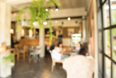 咖啡店或自助餐厅的模糊或离焦图像，用作背景，内部抽象模糊背景