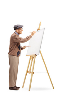 一位资深男性艺术家在白色背景上的画布上作画的全长镜头