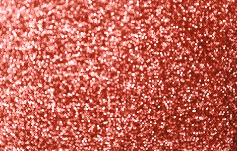 抽象背景与Bokeh离焦圣诞灯。 活珊瑚颜色的2019年。