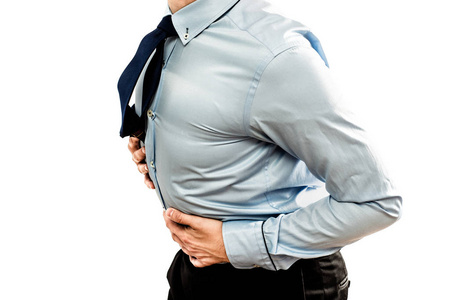 胃痛的医疗和保健概念。 男人因为疼痛而把手放在肚子上。 孤立在白色背景上。