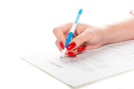 s hand with pen signing a contract isolated on white