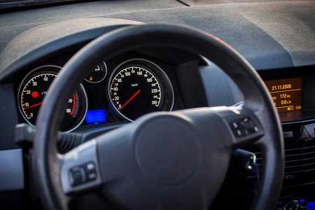 s seat, with luminous instruments speedometer on the dashboard o