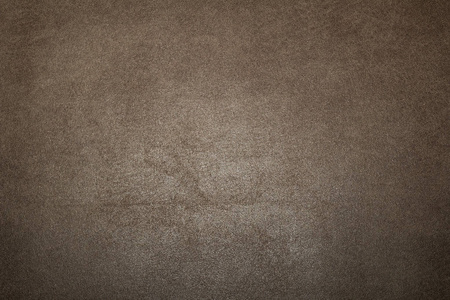 纯暗色调深棕色灰色面料的背景与粗糙照片