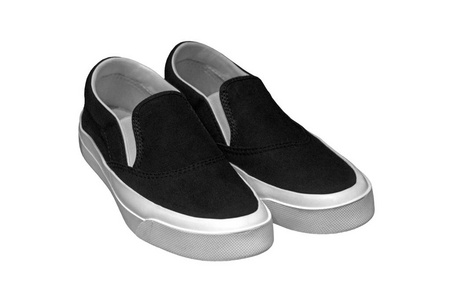 一双时尚的新黑色胶鞋隔离在白色背景上