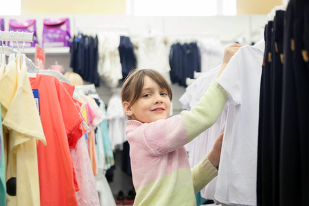 s clothing store choosing a school uniform