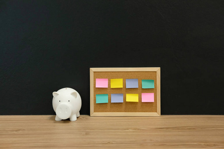  piggy bank on wooden desk. money saving finance investment conc