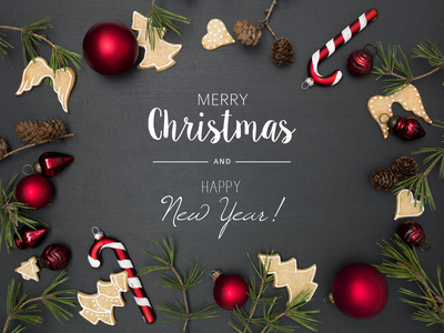 圣诞节背景，字母圣诞快乐，新年快乐，红色的面包和姜饼饼干框架