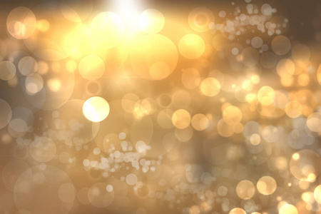 抽象模糊的圣诞节背景与波克离焦的金色灯光。