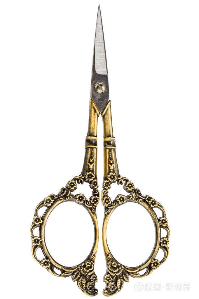 带有金色卷曲手柄的剪刀白色背景的