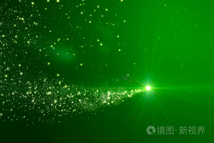 圣诞节灯光照耀粒子在绿色背景下的节日概念