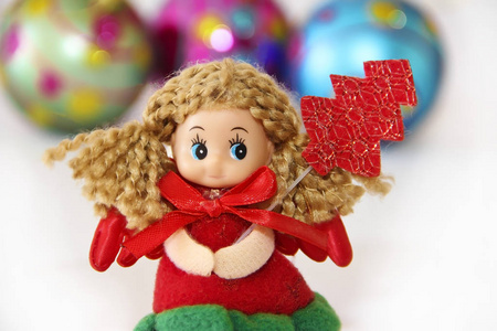 s little doll fairy in a festive Christmas red dress