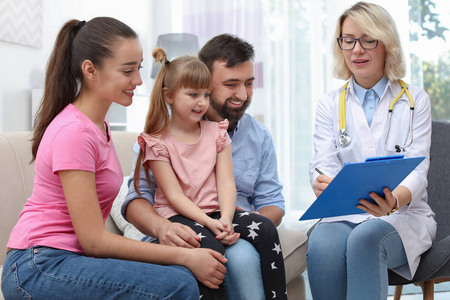 s doctor visiting little girl at home