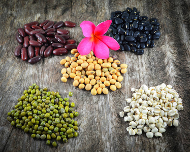 s tears  pile of cereal mix beans on wood background