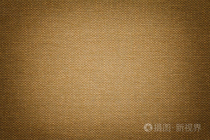 深棕色背景从纺织材料与柳条图案特写. 具有纹理的青铜织物的结构.