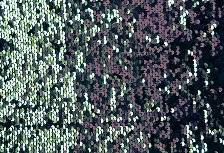 亮片作为背景,圆形亮片在时尚服装,彩色亮片纹理.